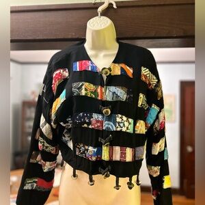 Hand sewn patchwork jacket with metal jingles on the bottom